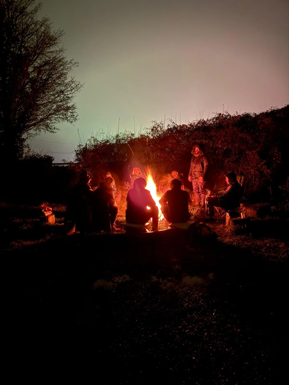 The Men's Fire Circle held around the fire at Well Bath.
