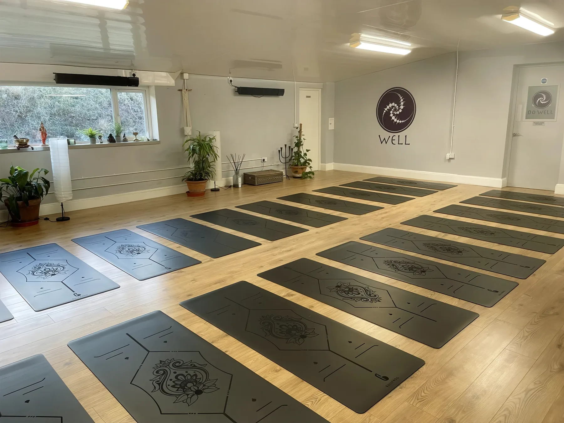 The Well Bath studio, empty and set out with yoga mats ready for a class.